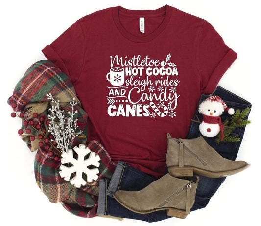 Mistletoe, Hot Cocoa, Sleigh Rides on Maroon Tee